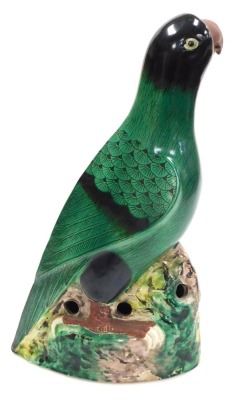 A 20thC Chinese pottery figure of a parrot, green glazed, on a naturalistic ground, with holes to the sides of the base, 36.5cm high. - 4