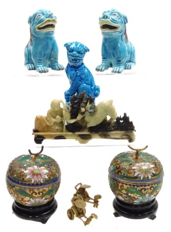 A group of Chinese porcelain and collectables, including a blue glazed dog of fo, two further dogs, and a pair of cloisonne pots and covers formed as fruit. (a quantity)