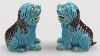 A group of Chinese porcelain and collectables, including a blue glazed dog of fo, two further dogs, and a pair of cloisonne pots and covers formed as fruit. (a quantity) - 2