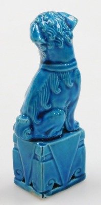 A group of Chinese porcelain and collectables, including a blue glazed dog of fo, two further dogs, and a pair of cloisonne pots and covers formed as fruit. (a quantity) - 8