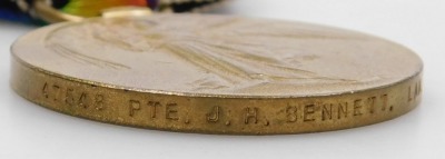 A WWI medal pair, comprising 1914-18 British War medal and Victory medal, inscribed to 47548 Pte. A M Bennett, Lancashire Fusiliers. - 3