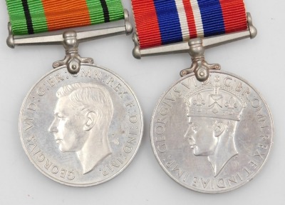 A WWI medal pair and later associated family medals, comprising 1914-18 British War medal and Victory medal, inscribed to 85536 Gnr. F Wilson, Royal Artillery, 1939-45 British War medal and Defence medal, and George VI General Service medal with South Eas - 2