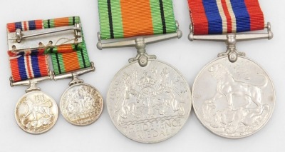 A WWII medal pair, comprising 1939-45 British War medal and Defence medal, and corresponding miniature dress medals. - 2