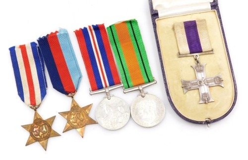 A WWII Military Cross medal group, comprising Military Cross, dated 1944, 1939-45 British War medal, Defence medal, France and Germany Star and 1939-45 Star, all unnamed, (Military Cross with original Morocco leather case).