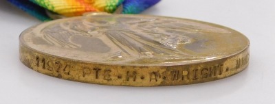 A WWI medal trio, comprising 1914-18 British War medal, 1914-15 Star and Victory medal, inscribed 11974 Pte. HA Wright, Manchester Rgt., all with replacement ribbons. - 4