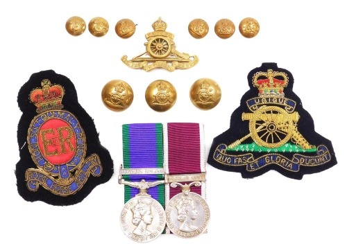 A Queen Elizabeth II General Service and Long Service and Good Conduct medal, General Service medal with Northern Ireland clasp, inscribed to 24224423 Gnr. MP Waude, Royal Artillery, with a set of Royal Artillery brass buttons and cap badge, and two braid