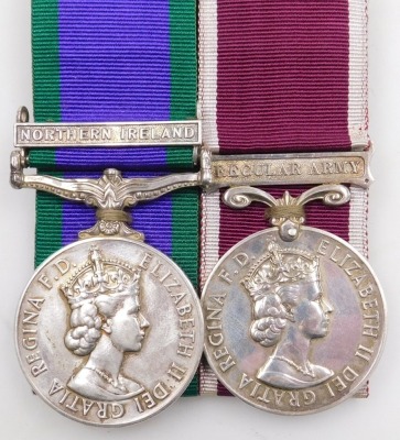 A Queen Elizabeth II General Service and Long Service and Good Conduct medal, General Service medal with Northern Ireland clasp, inscribed to 24224423 Gnr. MP Waude, Royal Artillery, with a set of Royal Artillery brass buttons and cap badge, and two braid - 2