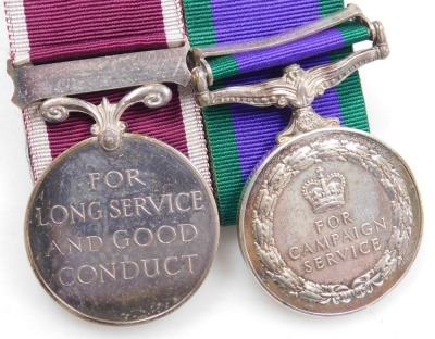 A Queen Elizabeth II General Service and Long Service and Good Conduct medal, General Service medal with Northern Ireland clasp, inscribed to 24224423 Gnr. MP Waude, Royal Artillery, with a set of Royal Artillery brass buttons and cap badge, and two braid - 3