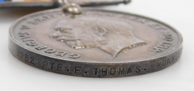 Two WWI medal pairs, both comprising 1914-18 British War medal and Victory medal, one pair inscribed to 3262 Pte. F Thomas, Monmouth Rgt., and the other pair to his brother 5495 AS GE Thomas, RAMC. - 4