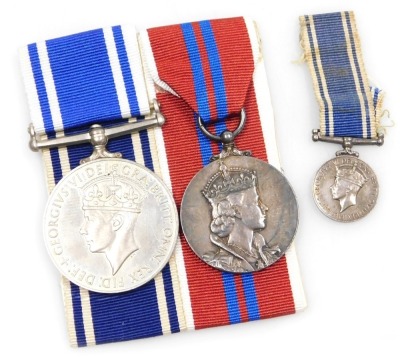 A George VI Police Long Service and Good Conduct Medal, with miniature and Elizabeth II Coronation medal 1953, the Police medal inscribed to Inspr Frank McGinn.