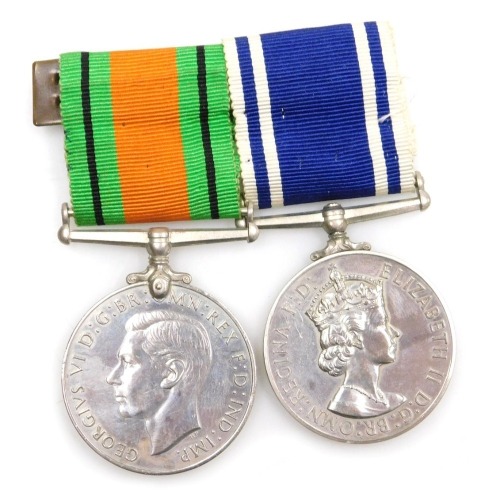 An Elizabeth II Police Long Service and Good Conduct medal and Defence medal, the Police medal inscribed to Sgt Frank H Blanchard.