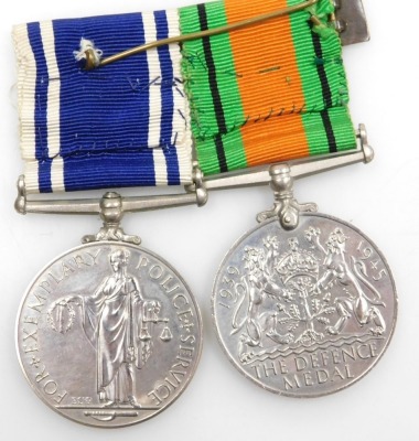 An Elizabeth II Police Long Service and Good Conduct medal and Defence medal, the Police medal inscribed to Sgt Frank H Blanchard. - 2