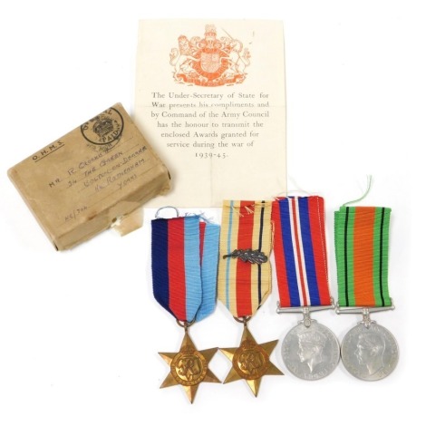 A WWII medal group, comprising 1939-45 British War medal, the 1939-45 Star, Africa Star with oak leaf insignia (MID) and Defence medal, with OHMS box addressed to Mr R Crockett, 34 The Green, Bolton-on-Dearne Near Rotherham Yorkshire.