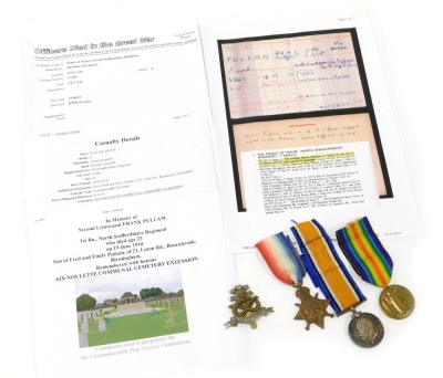 A WWI medal trio, comprising 1914-18 British War medal, 1914-15 Star and Victory medal, inscribed to 2nd Lieut F Pullam Killed in Action 19/06/18, and with North Staffordshire sealed knot cap badge.