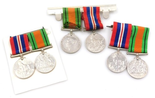 Three pairs of WWII medals, each comprising 1939-45 British War medal and Defence medal, mounted.