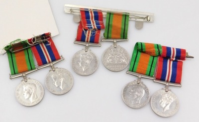 Three pairs of WWII medals, each comprising 1939-45 British War medal and Defence medal, mounted. - 2