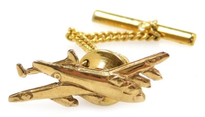 A 9ct gold Lancaster Bomber lapel brooch, with gilt metal retainer.