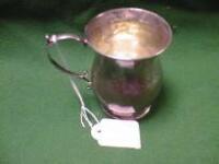 A silver christening mug