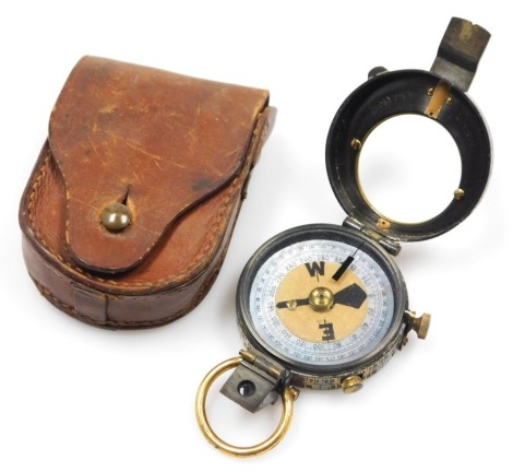 A WW1 brass military compass by Negretti & Zambra, the inner lid hand inscribed Smyth Hitchin, in leather pouch case.