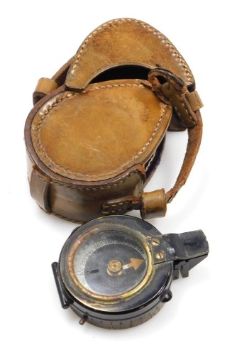 A WWI military brass compass, in leather case.