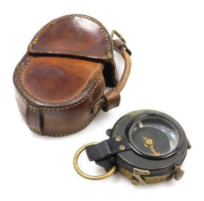 A WWI military brass compass, Verner's pattern, stamped 1918 E Koehn, Geneve, Suisse, the leather case stamped Capt ED Galbraith, 65th Kokes Rifles FF.