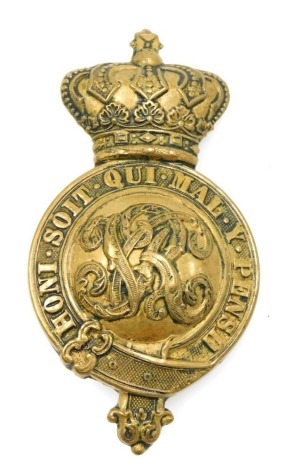 A Victorian brass horse martingale regimental badge.