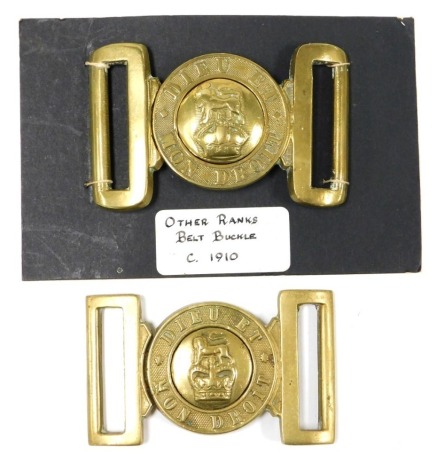 Two British Army brass belt buckles, each inscribed Dieu et Mon Droit, with central crown and lion surmount boss.