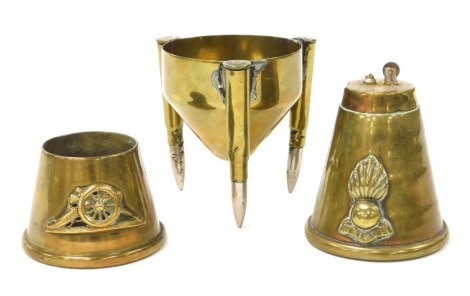 WWI brass ordnance shell cigarette lighter, conical ash receiver and brass trench craft stand. (3)