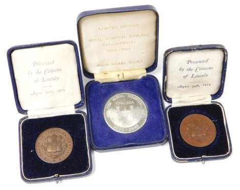 Two Lincoln Great War Tribute medals, each inscribed In Token of Lincoln's Gratitude, circa 1919, both cased, and a Royal Hospital Chelsea Tercentenary limited edition commemorative medal, cased. (3)