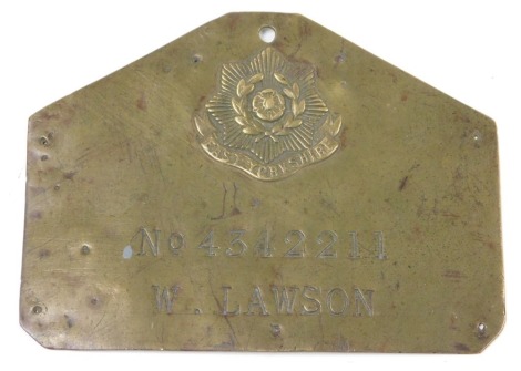 A brass identification plate for the East Yorkshire Regiment, named to W Lawson, number 4342211, with regimental crest, 7cm x 11.5cm.