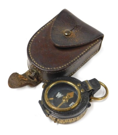 A WWI brass military compass by Negretti & Zambra, London, in leather case.