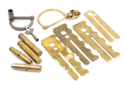 Various brass military button sticks, two kit bag locks, two tool kits and two brass cased gun oil cans.