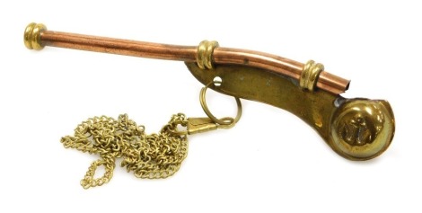 A Naval brass and copper bosun's whistle.