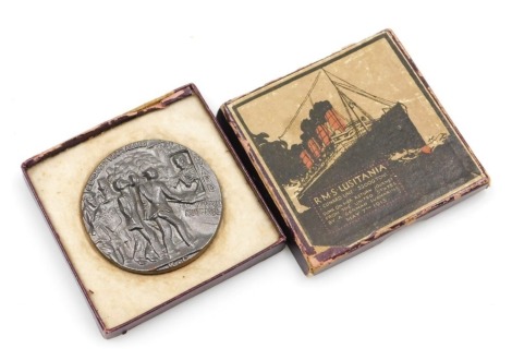 An RMS Lusitania metal, in original box.