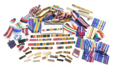 A collection of medal ribbons and medal ribbon tunic bars, predominantly WWI and WWII. (1 bag)