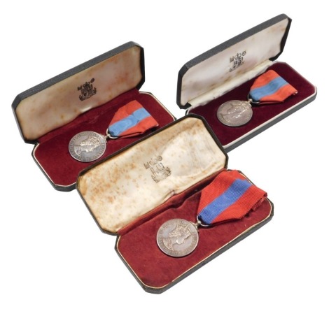 Three Elizabeth II Imperial Service Medals, issued to Mrs Margaret Foster, Clifford Owen Putnam and Alfred George Brown, all cased.