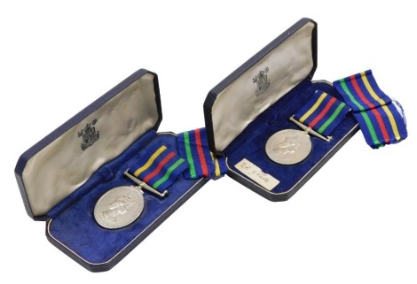 Two Elizabeth II Civil Defence Long Service Medals, both unnamed and cased.