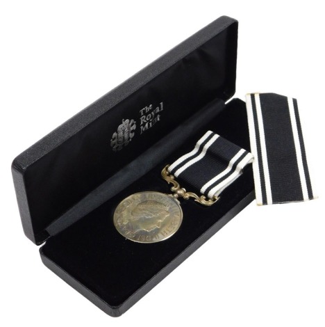 An Elizabeth II Prison Service, Long Service and Good Conduct medal, inscribed to Officer K Pratt MD198, cased.