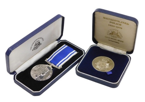 Police interest. A Queen Elizabeth II Police Long Service medal, inscribed to Constable John A Peverill, cased, and a Metropolitan Police 150th Anniversary medallion, 1829-1879 (Tower Mint), cased. (2)