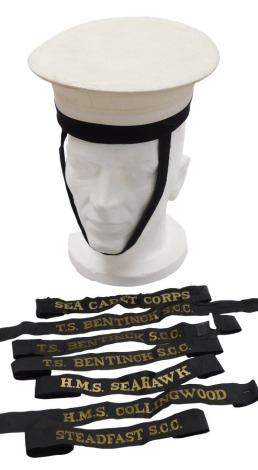 A Royal Naval rating cap and seven cap tallies, including MS Sea Hawk, Sea Cadet Corps, TS Bentinck SCC, HMS Collingwood.