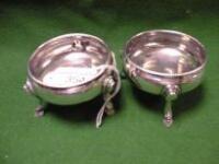 A pair of George III silver cauldron salts on stepped hoof feet