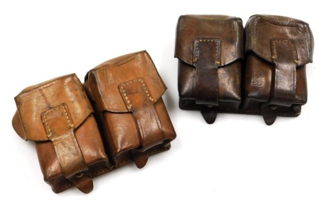 Two German WWI leather double ammunition belt pouches, both with indistinct stamped marks to the reverse.