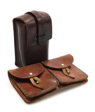 Two leather ammunition belt pouches, including one double ammunition pouch stamped Foucault 7-Lapaliss 3-46.