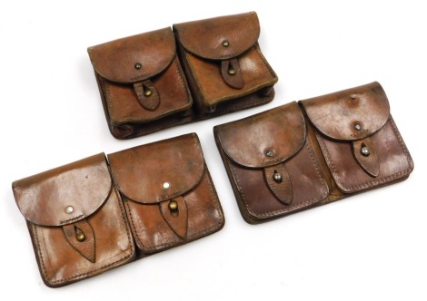 Three French Army double leather ammunition belt pouches, one stamped Hollmann & Co Tuttlingen.