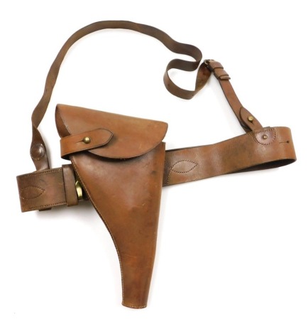 A WWI period British Army Sam Browne belt, with shoulder strap and leather revolver holster.