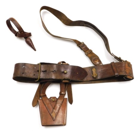 A WWI period British Army Sam Browne leather belt, with shoulder strap and sword frog.