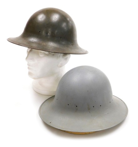 Two WWII period British steel helmets, one marked RO & Co 9/41.