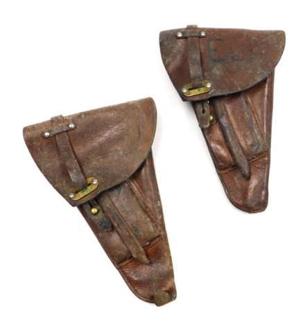 Two Swedish leather pistol holsters.