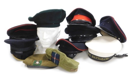 An assortment of British Military headdress, dress caps, including naval ratings cap with HMS Battleaxe tally, two berets. (10)