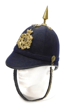 An early 20thC British Army blue cloth helmet, with regimental badge for 10th Regiment of Foot (North Lincolnshire Regt), helmet plate currently mounted to the rear of the helmet.